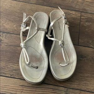 Calvin Klein Thong Sandal. Gold finish, size 8.